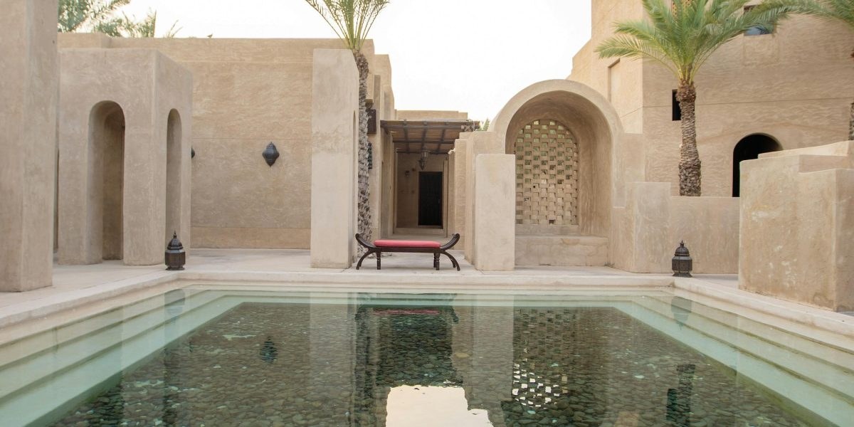 Front façade of a luxury Dubai mansion overlooking a private pool