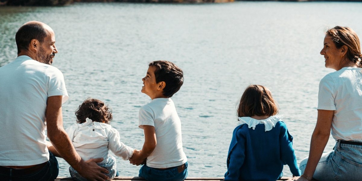 A family enjoying their private lakefront retreat, highlighting the serene and exclusive lifestyle offered in Muskoka.
