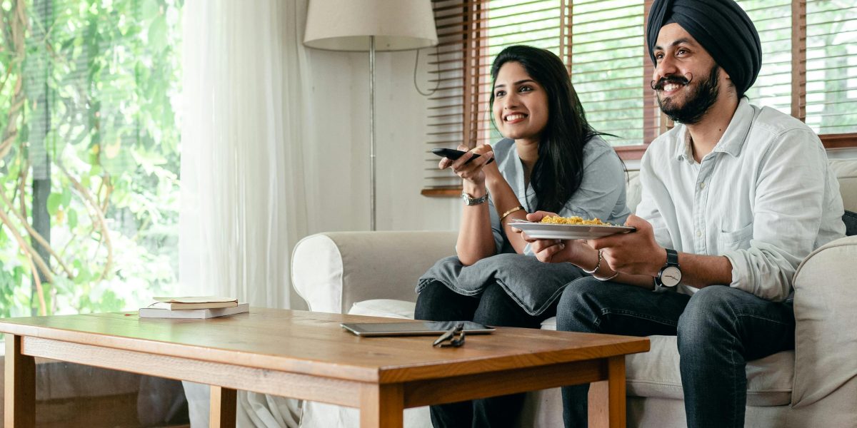 A couple enjoying the comfort and elegance of their well-designed luxury home.