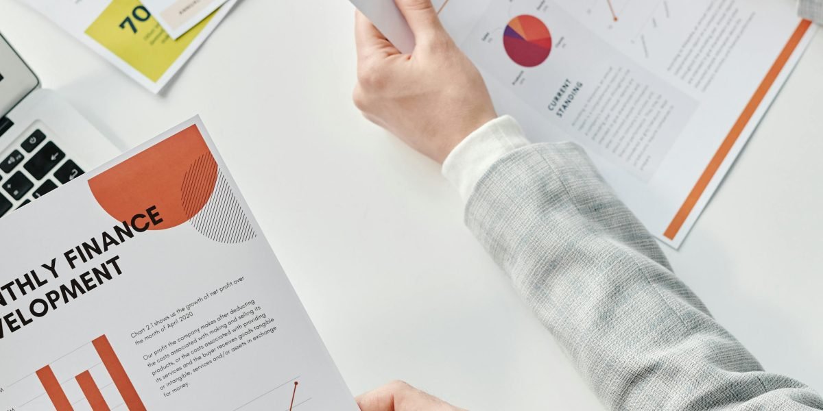 A team discusses financial strategy, mirroring diversified investment across markets.