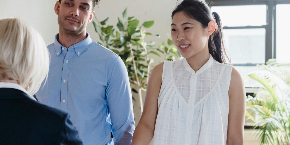 A real estate agent provides expert guidance to international clients during the buying process.