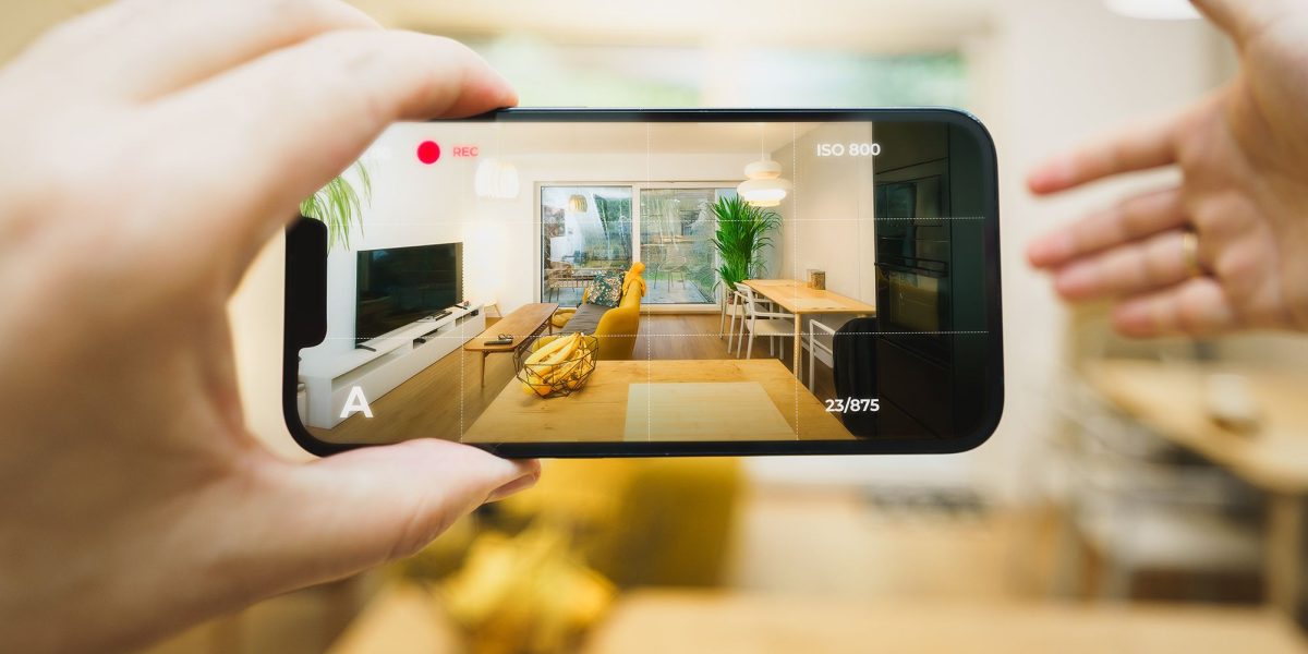 A couple from Dubai virtually tours a luxury home in Orlando using a tablet, guided by a real estate agent on screen.