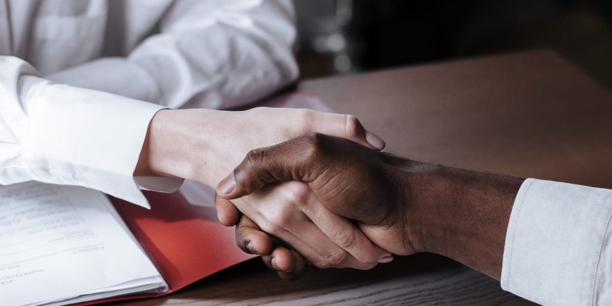 A discreet consultation, emphasizing the privacy and confidentiality upheld in luxury real estate transactions.