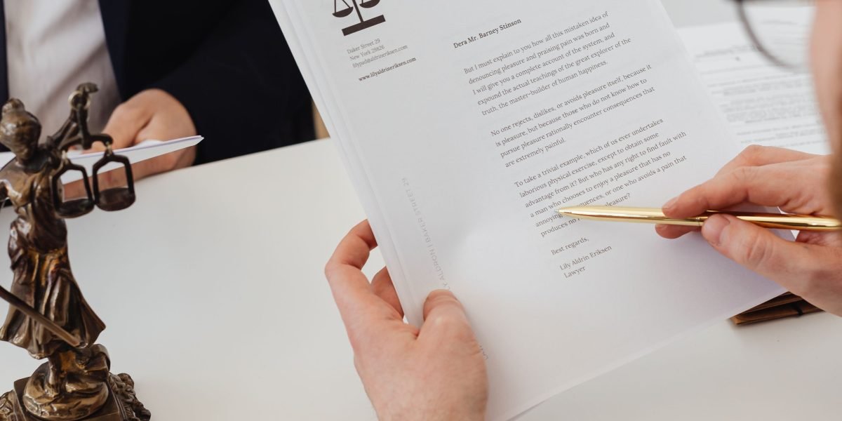 An expert guiding a client through complex legal documents related to international property laws.