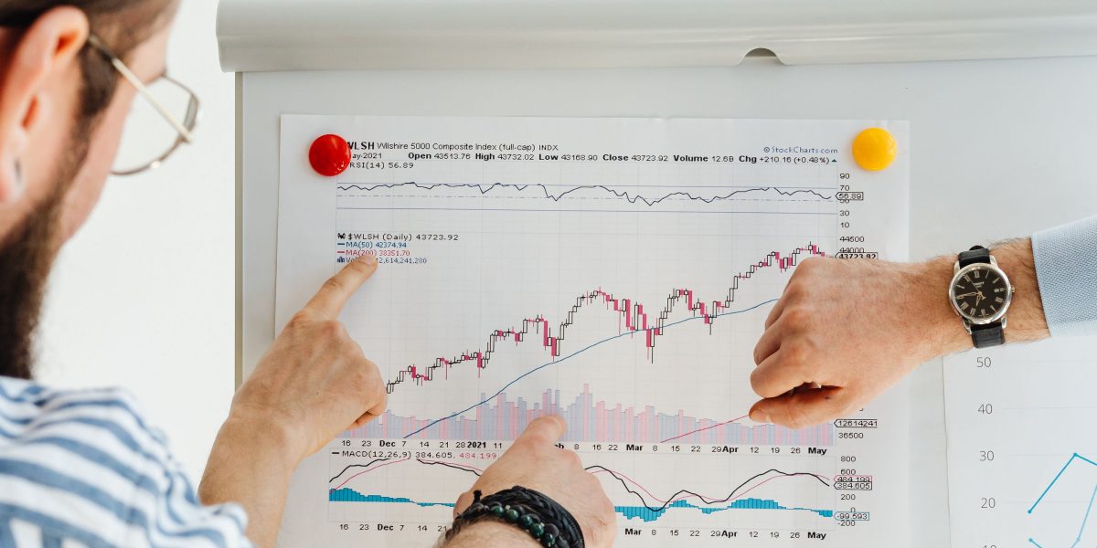 A team collaborating to analyze future trends and strategic positions in the luxury real estate market.