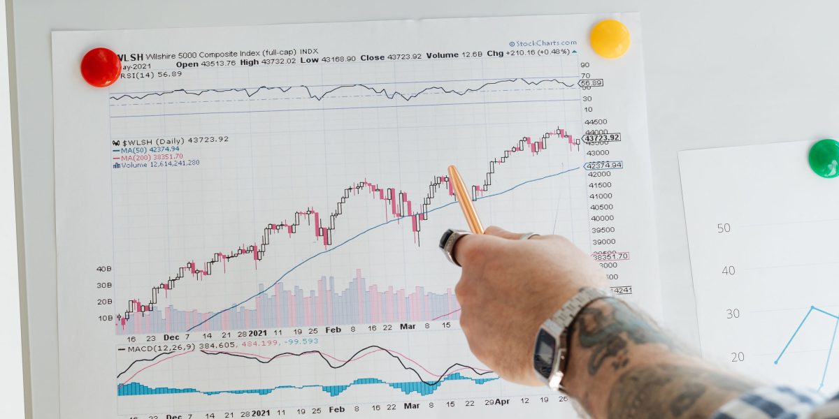 A discerning international investor carefully evaluating complex market data and global opportunities.
