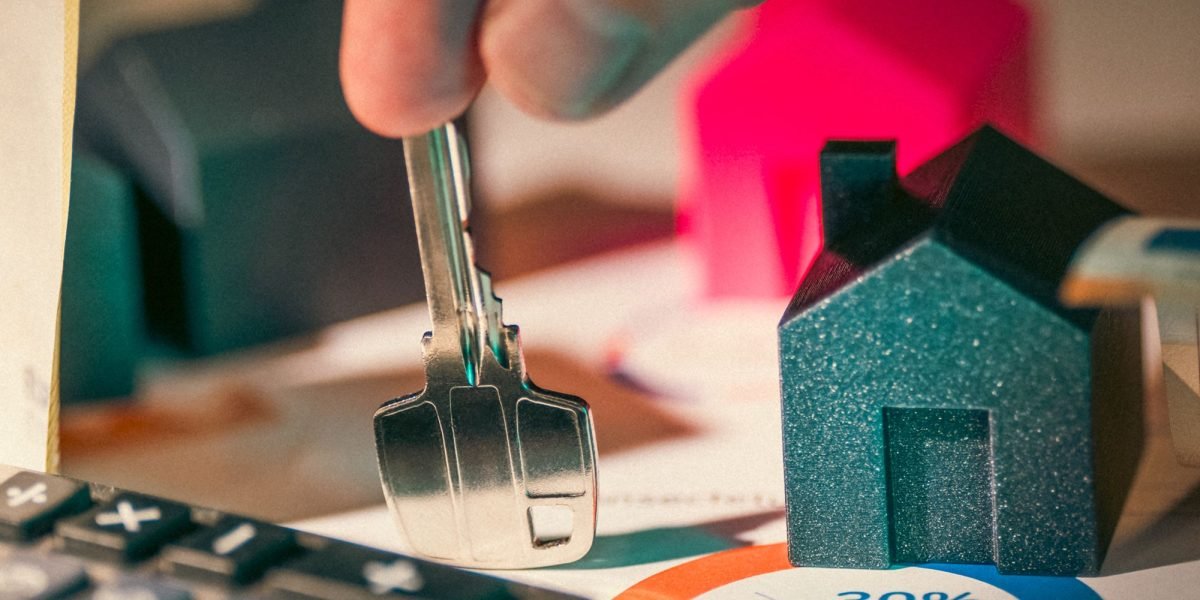 An investor thoughtfully considering different strategies for their property portfolio.
