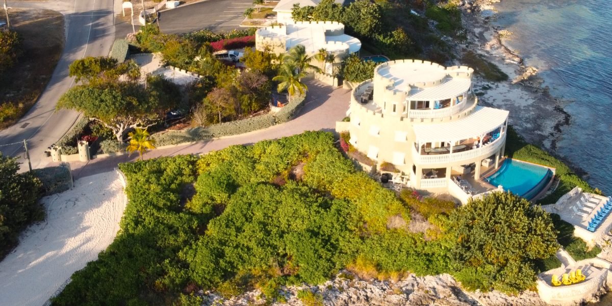 A discreet conversation between an agent and client about exclusive, off-market luxury properties.
