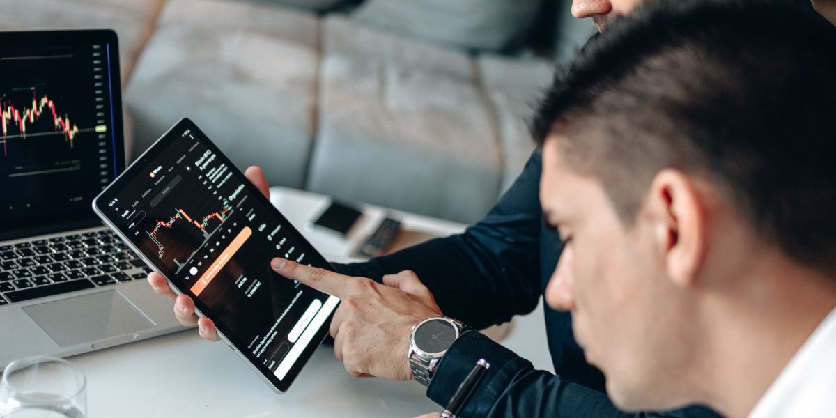 Professionals engage in a private meeting to discuss exclusive investment opportunities.