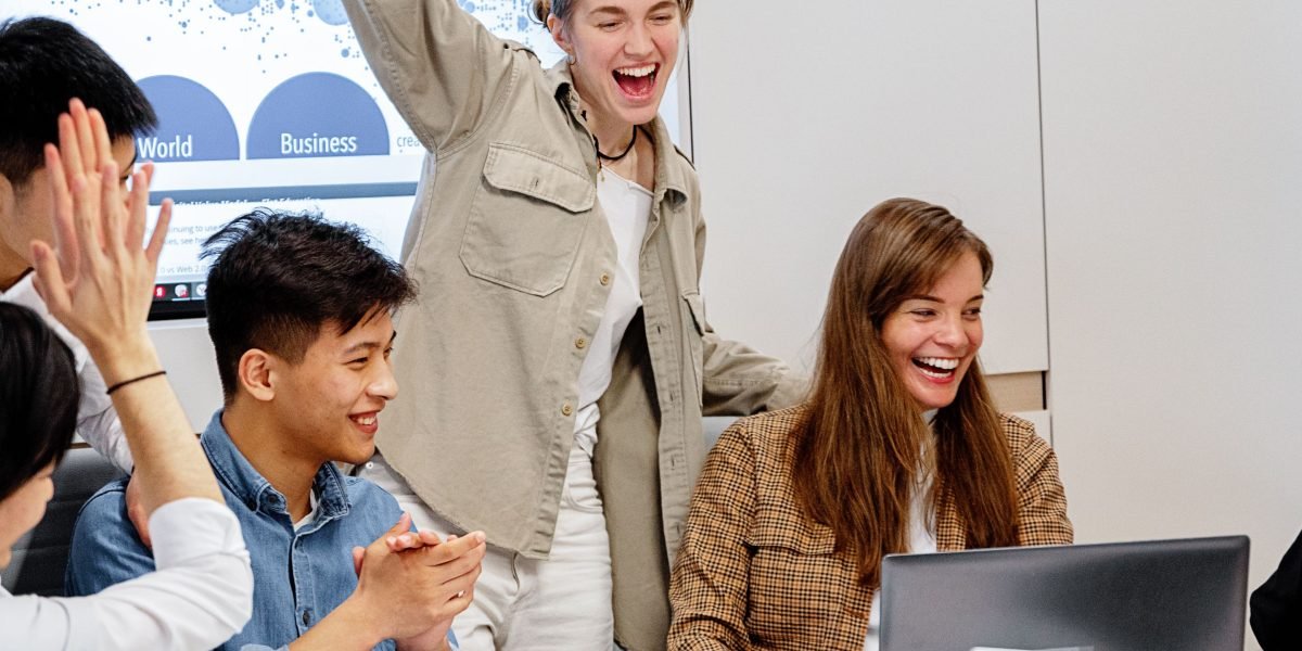 A team celebrating a successful real estate deal, symbolizing achievement and a positive outcome.