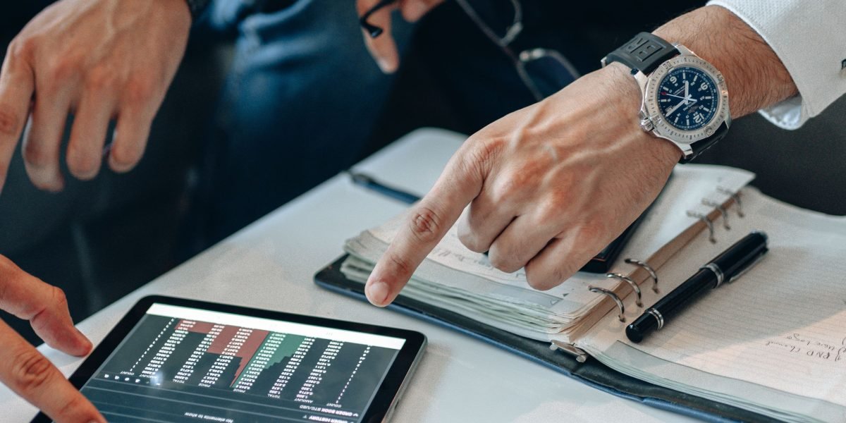 An investor carefully examining market trends and valuation insights for strategic real estate decisions.