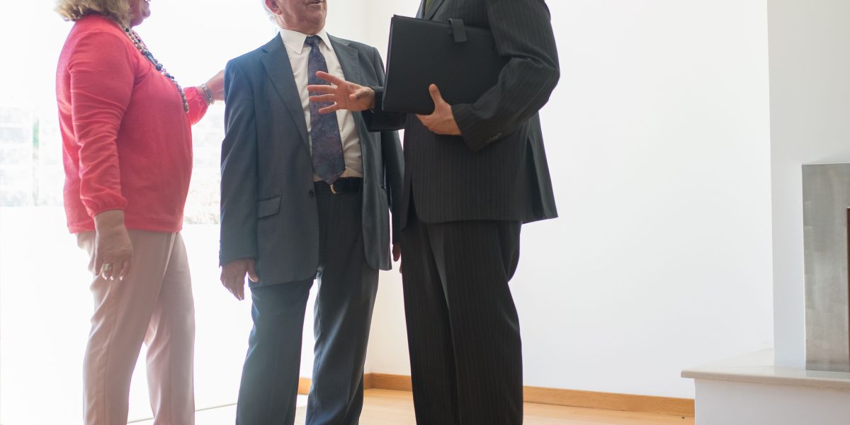 An experienced real estate agent discussing exclusive off-market luxury properties with a client in a sophisticated setting.