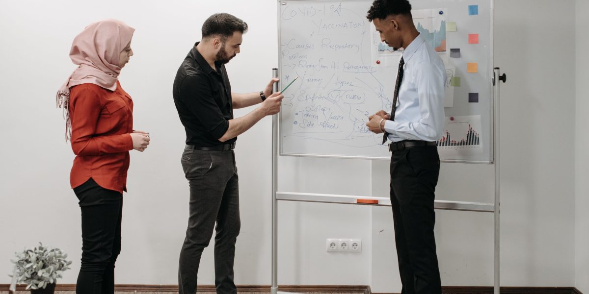 A team of professionals collaborating on a strategic plan, representing the expert guidance needed for off-market property deals.